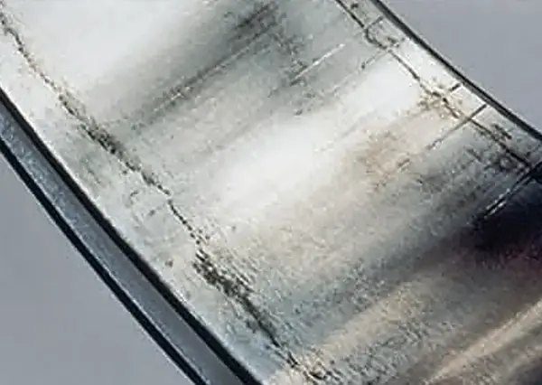 Scuffing on an inner ring bore from excessive interference with the shaft.