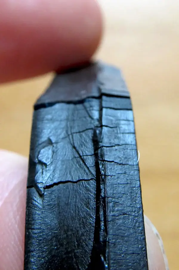 Hardened, cracked seal from high running temperature.