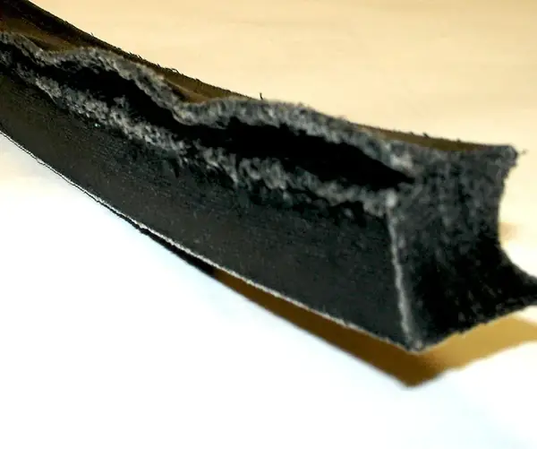 Extrusion: seal material nibbled into the clearance gap.