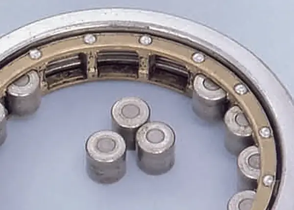 Wear on cage pocket surfaces.