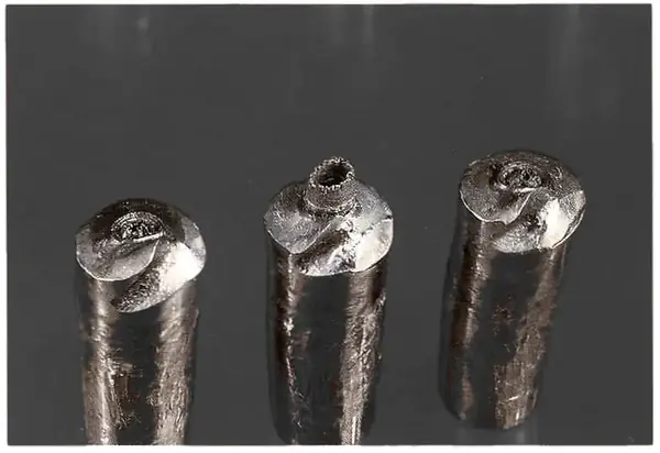 Close-up of plastically deformed roller ends.
