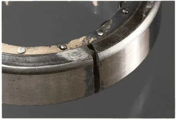Outer race fractured by the prying action of a misaligned shaft.