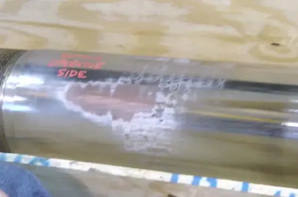 Rod surface worn by side loading.