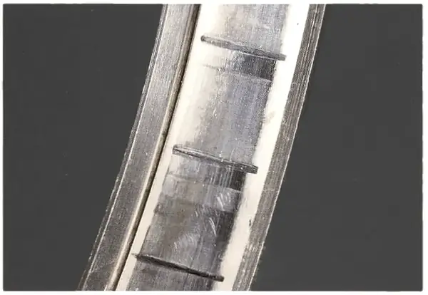 False brinelling: marks at the roller spacing, grinding and normal wear patterns disturbed.